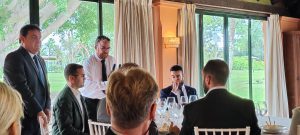 El arqueólogo Alejandro Jiménez expone los nuevos descubrimientos de Itálica en el Rotary Club Sevilla International con la visita de rotarios del club de Leverkusen